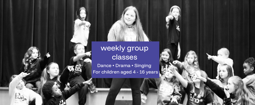group photo on stage, weekly classes, ages 4-16 years